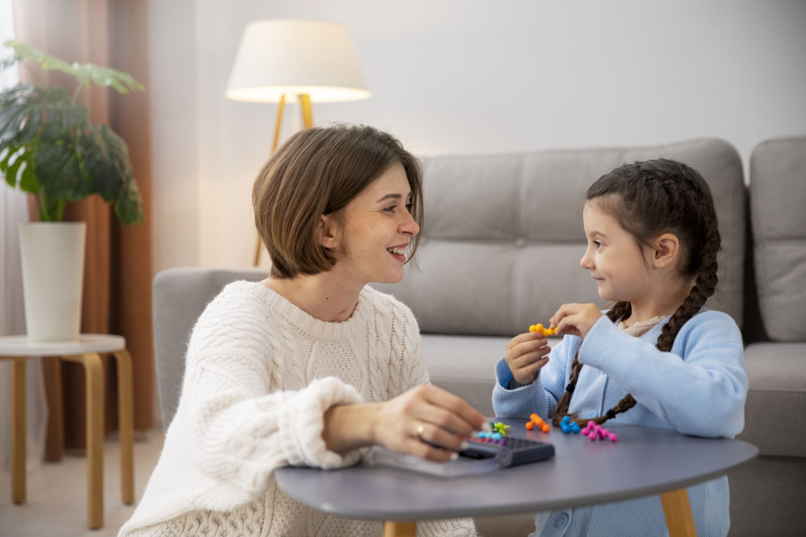front-view-mother-kid-playing-memory-game (1)
